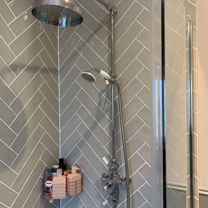 En-Suite Shower room : Corner cubicle showing herringbone style tiling with deluge shower